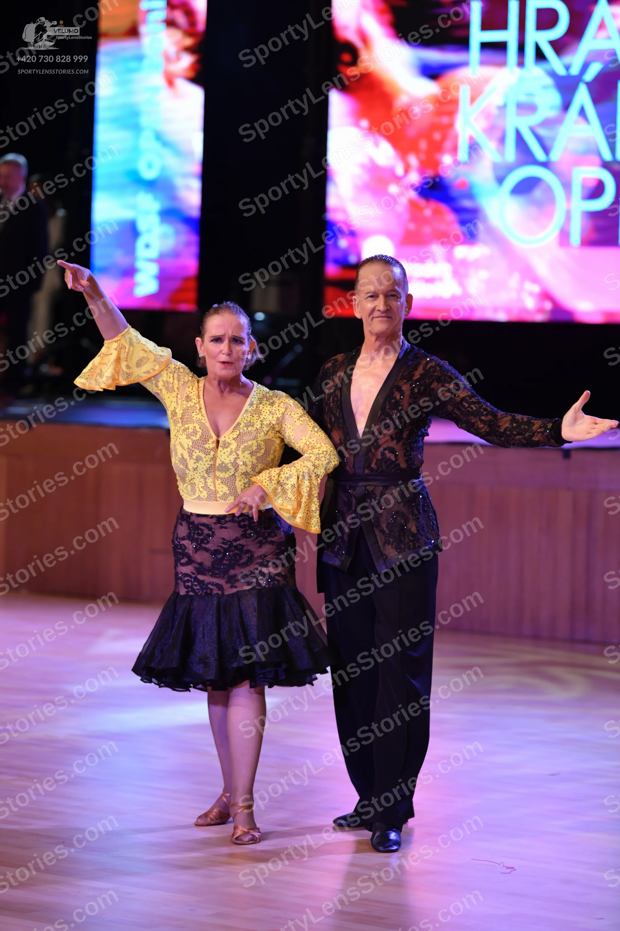 Dancesport competitor: ** Black suit with a wide, sequined lapel