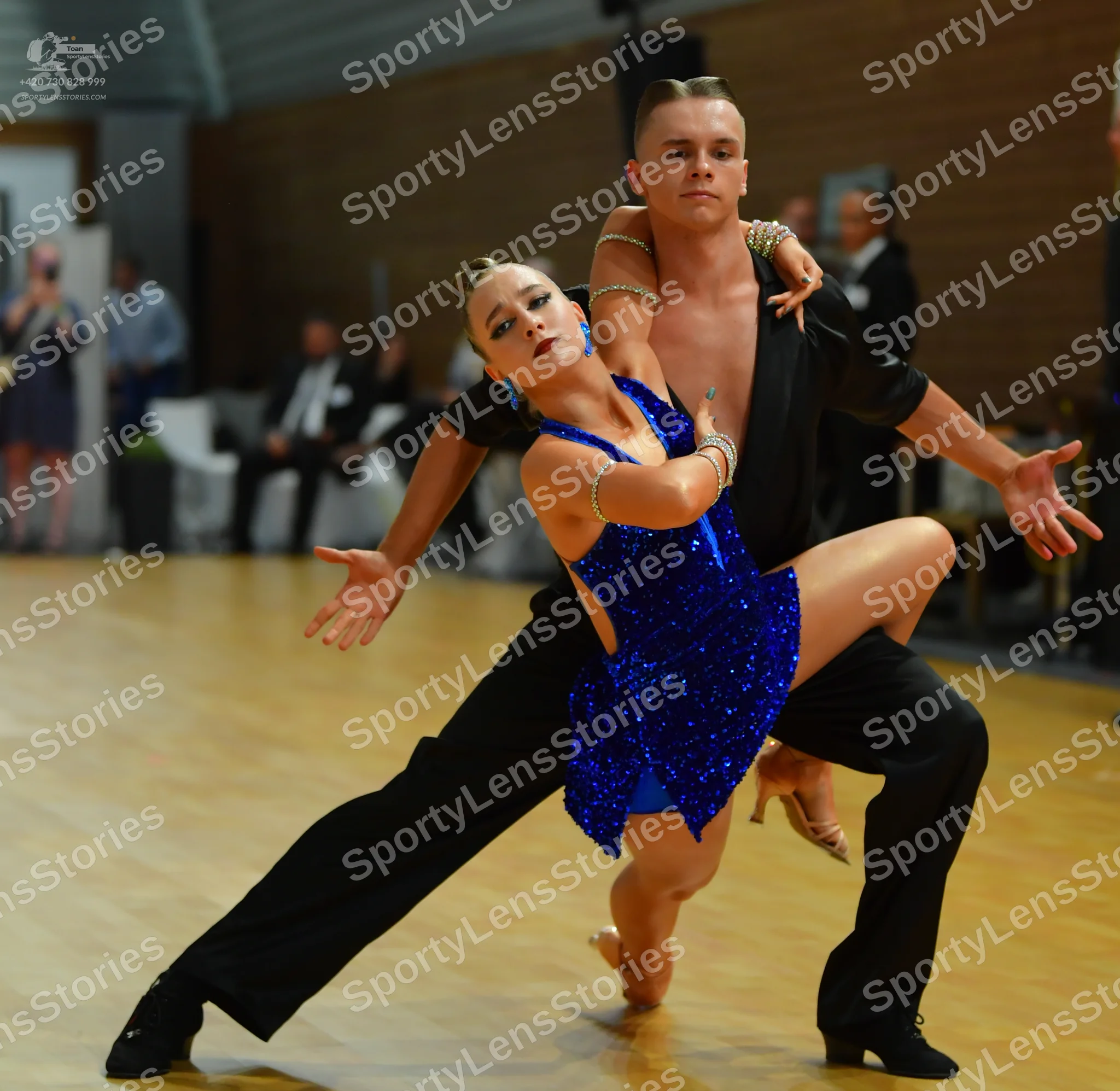 Dancesport competitor: ** Black sequins suit