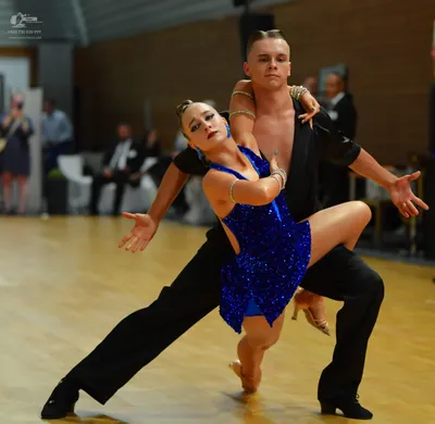 Dancesport competitor: ** Black sequins suit