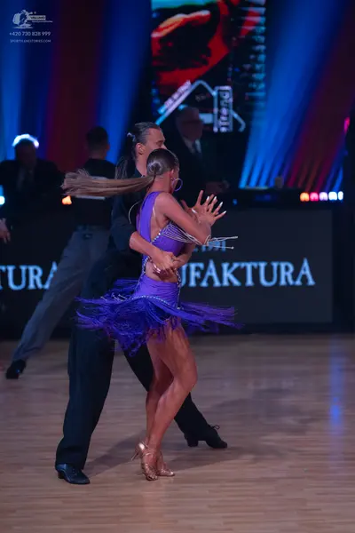 Dancesport competitor: Male dancer: black long-sleeved shirt and black trousers