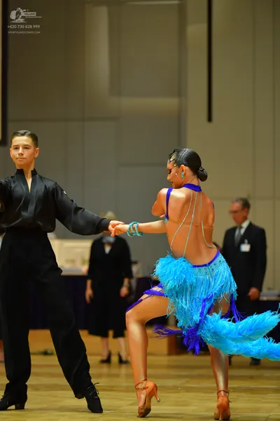 Dancesport competitor: Male dancer: black long-sleeved shirt and black trousers