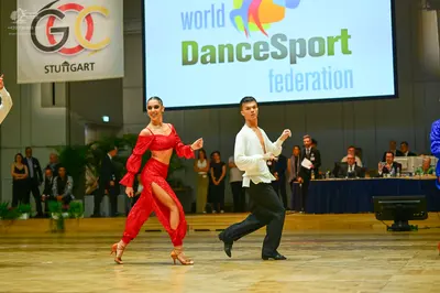 Dancesport competitor: Male dancer: white long-sleeved shirt and black trousers