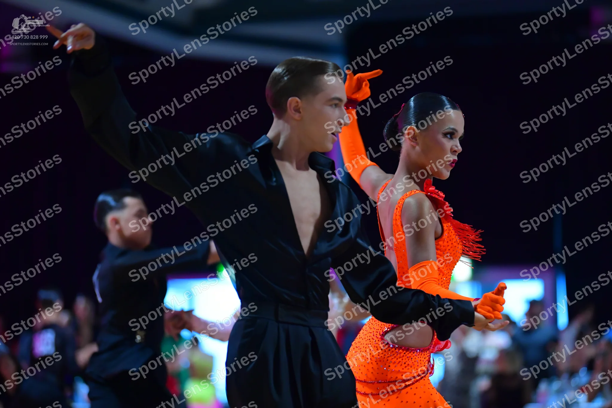 Dancesport competitor: Male dancer: black long-sleeved shirt and black trousers
