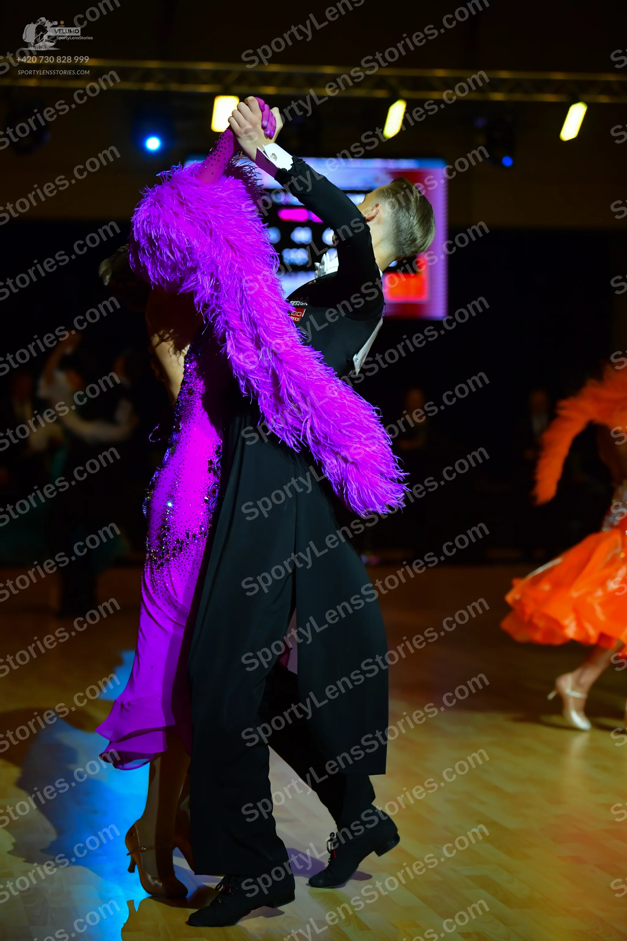 Dancesport competitor: Male dancer: black ballroom suit with a white shirt and black trousers