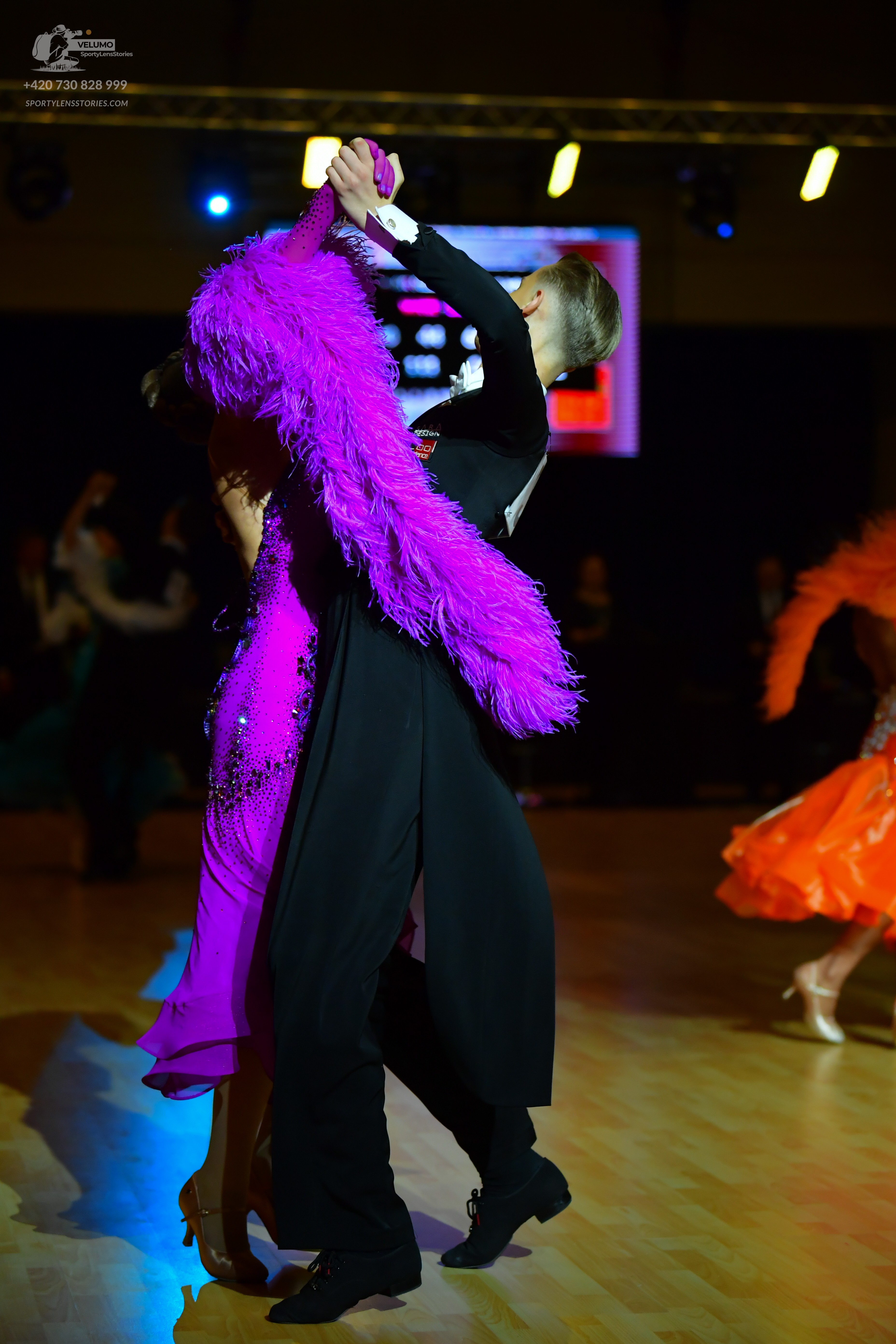 Dancesport competitor: Male dancer: black ballroom suit with a white shirt and black trousers