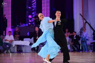 Dancesport competitor: Male dancer: black suit with black trousers