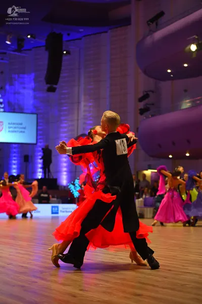 Dancesport competitor: Male dancer: black suit and trousers