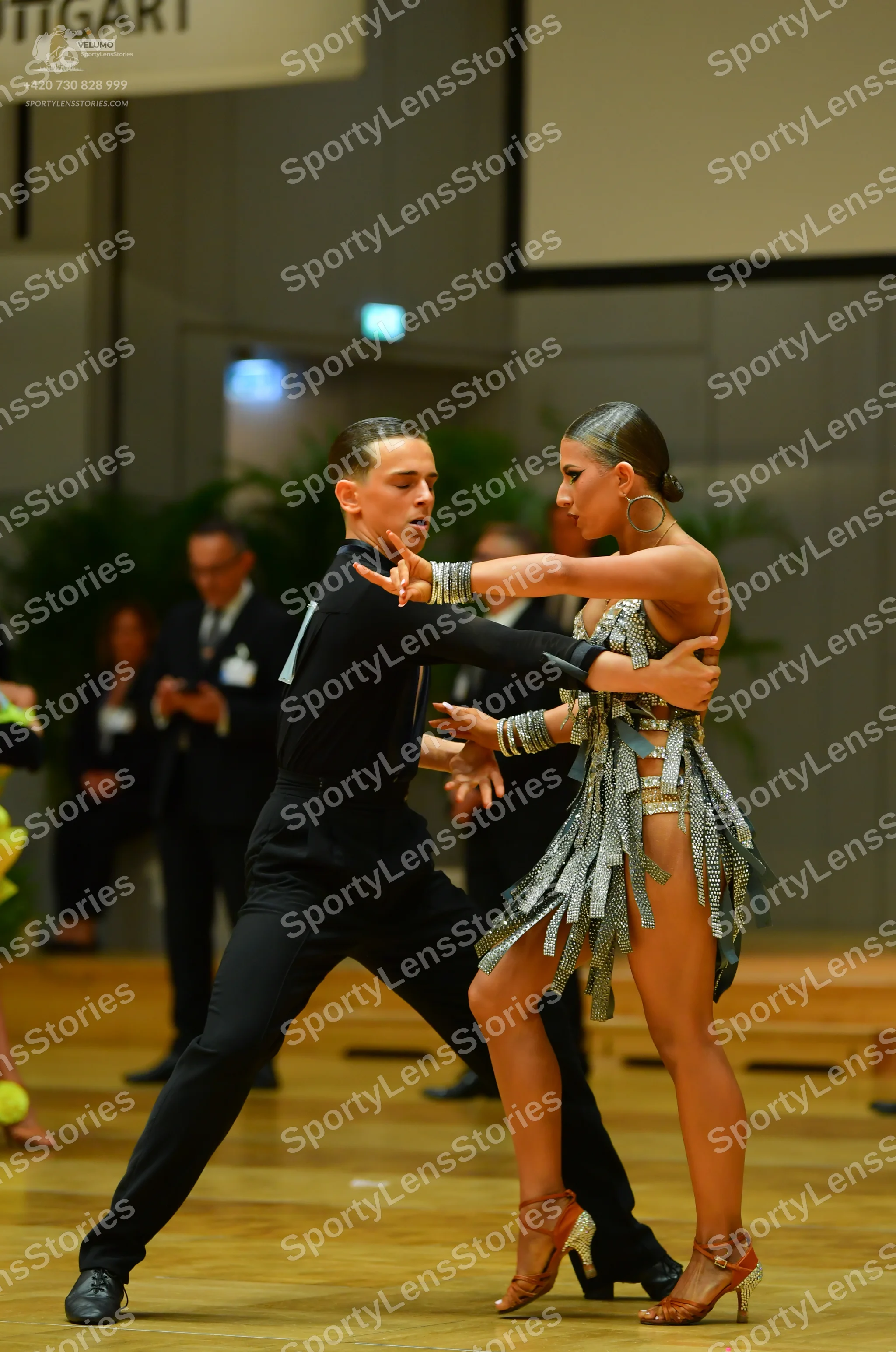Dancesport competitor: Male dancer: black long-sleeved shirt and black trousers