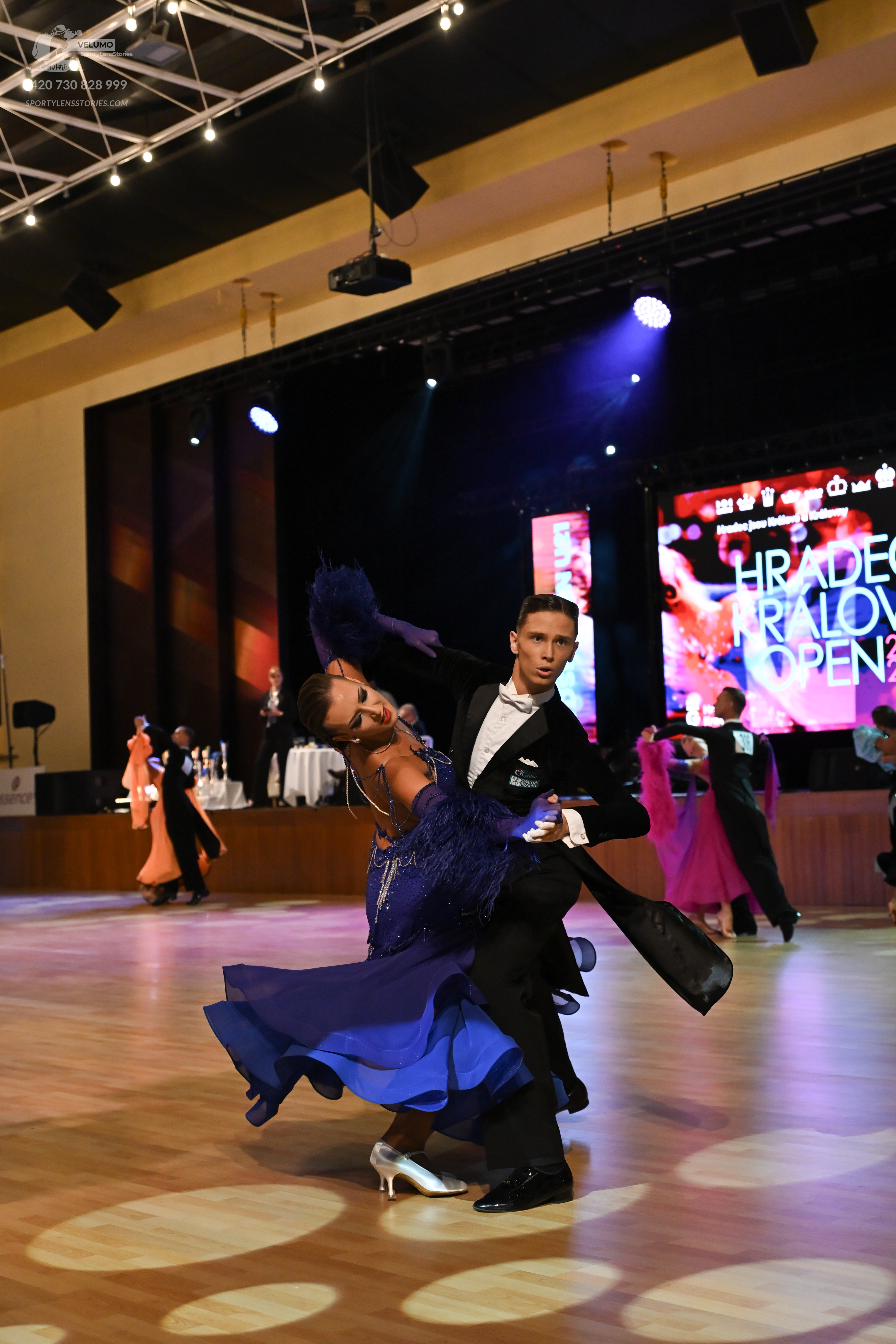 Dancesport competitor: ** Black suit with a satin jacket and trousers