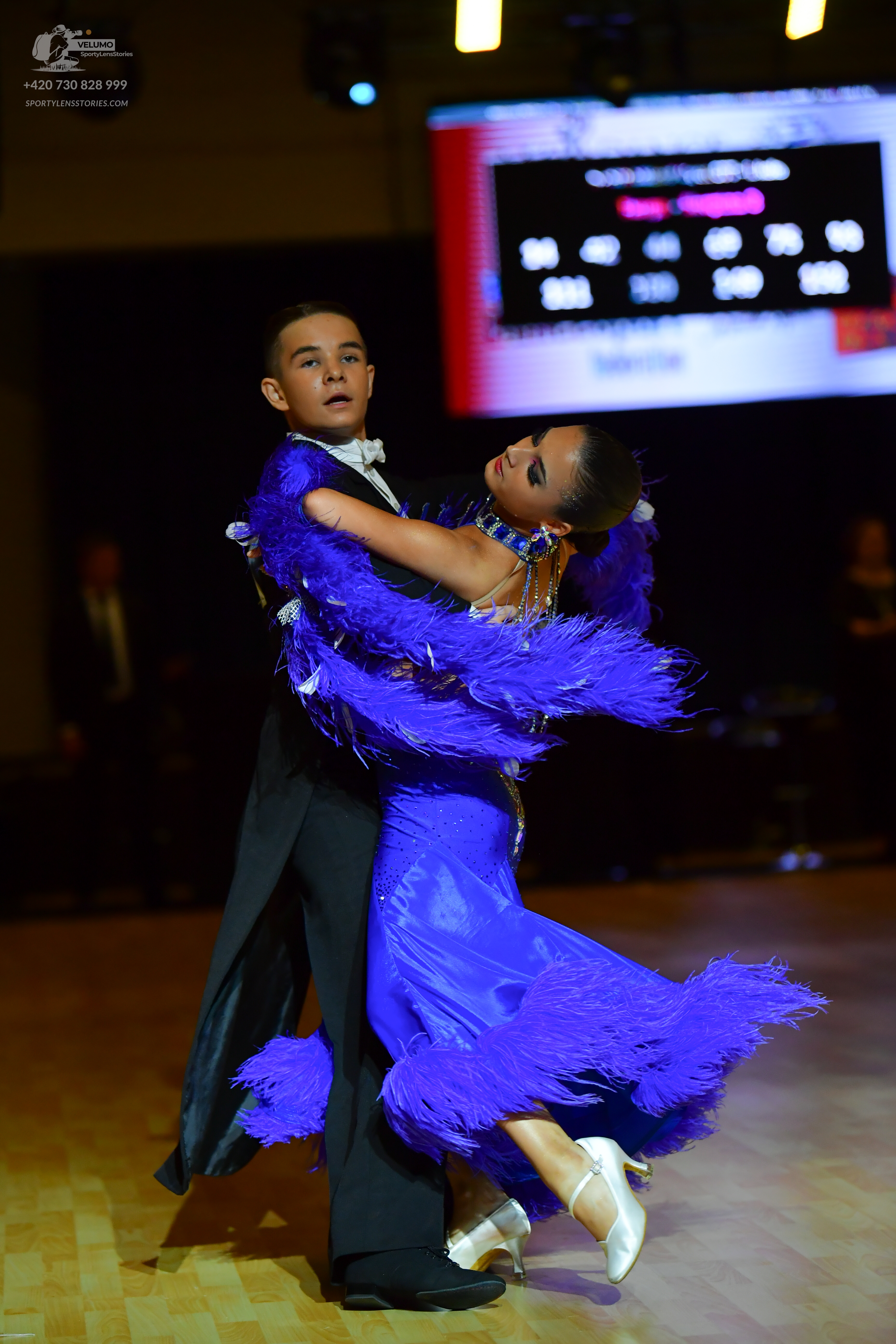 Dancesport competitor: Male dancer: black tuxedo with a white shirt and white bowtie