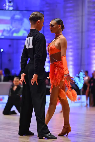 Dancesport competitor: Male dancer: black long-sleeved shirt and black trousers