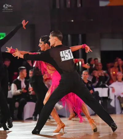 Dancesport competitor #451: Male dancer: black long-sleeved shirt and black trousers