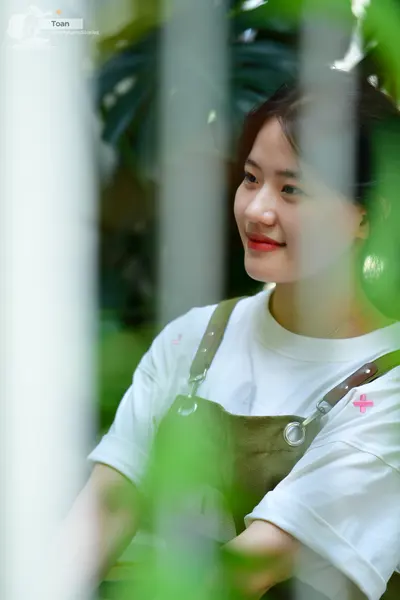 Dancesport competitor: Female dancer: white t-shirt and olive green overalls