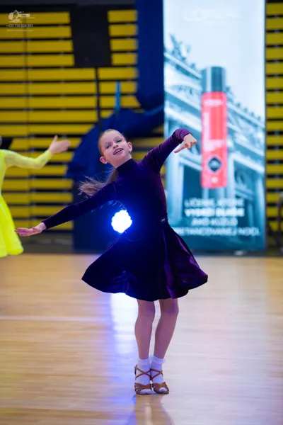 Dancesport competitor: ** Red Latin Dress
*   **Color:** Bright Red
*   **Fabric:** Satin (appears to b