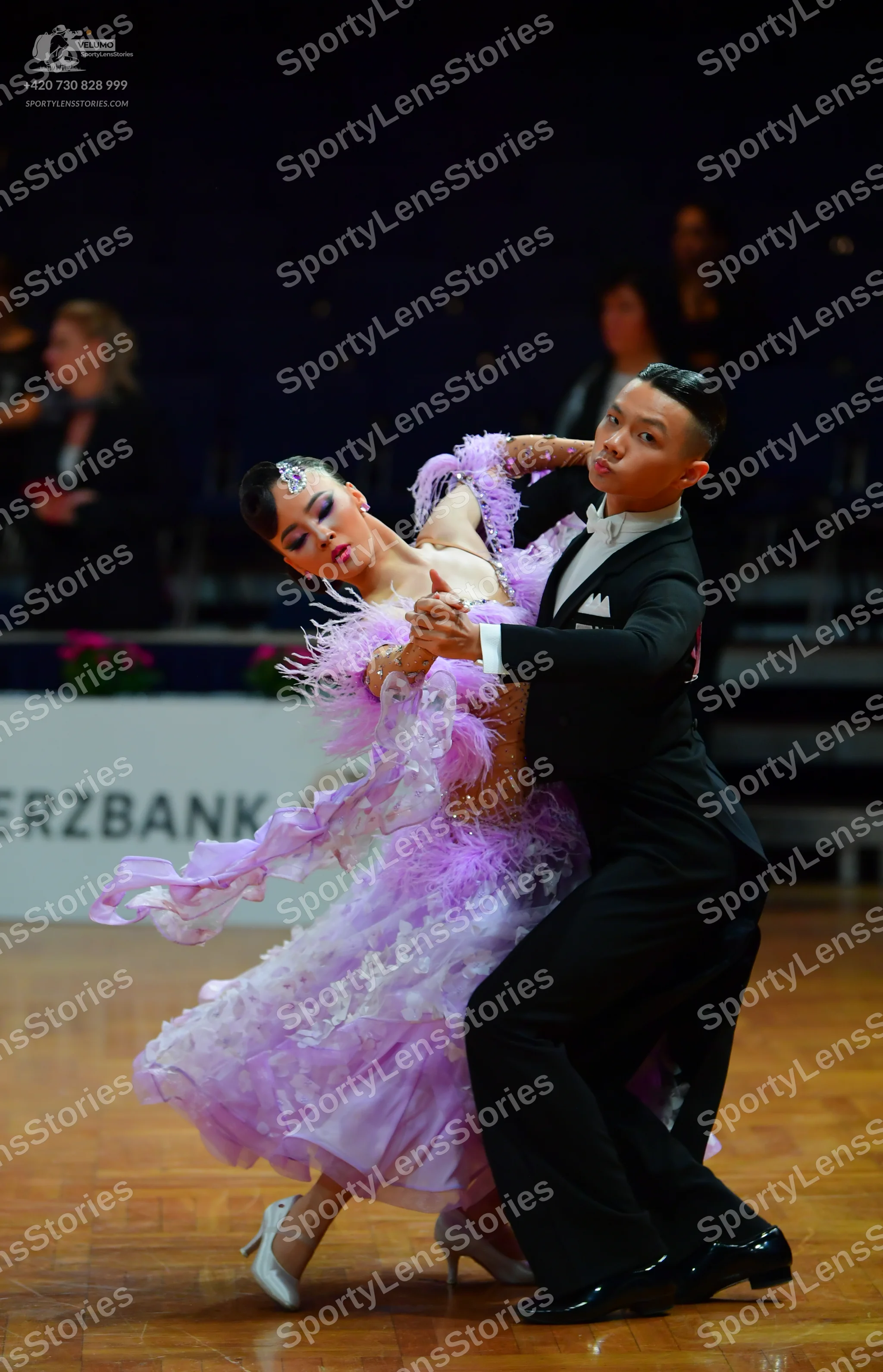 Dancesport competitor: Male dancer: black suit with a white shirt and black bow tie