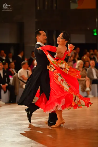 Dancesport competitor: Male dancer: black ballroom suit