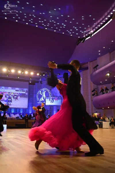 Dancesport competitor: Male dancer: black suit
