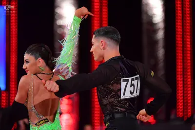 Dancesport competitor #757: Male dancer: black long-sleeved shirt with black lace/mesh detail and black trou