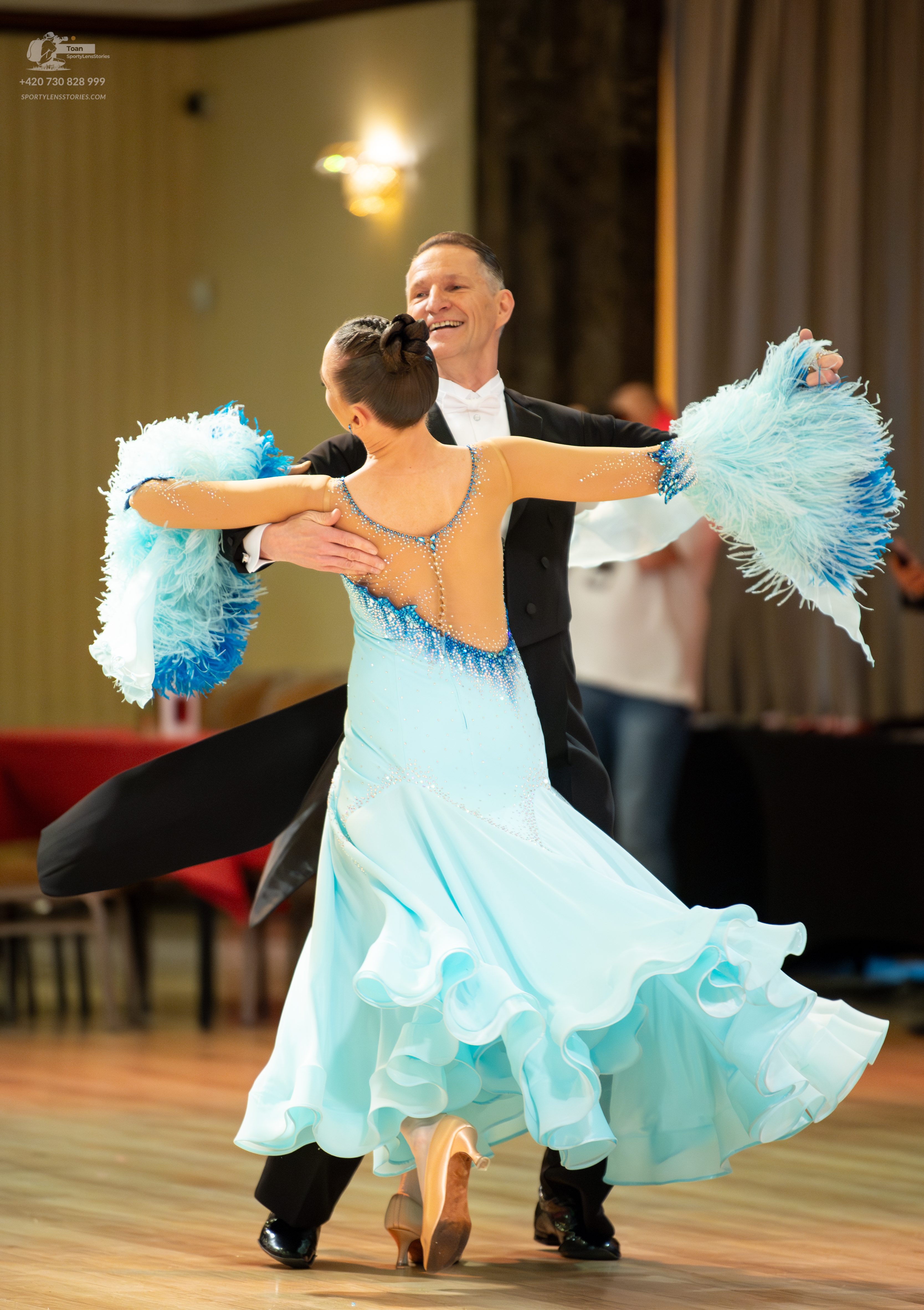 Dancesport competitor: Male:** Black tail suit with a subtle sequin detail on the lapels