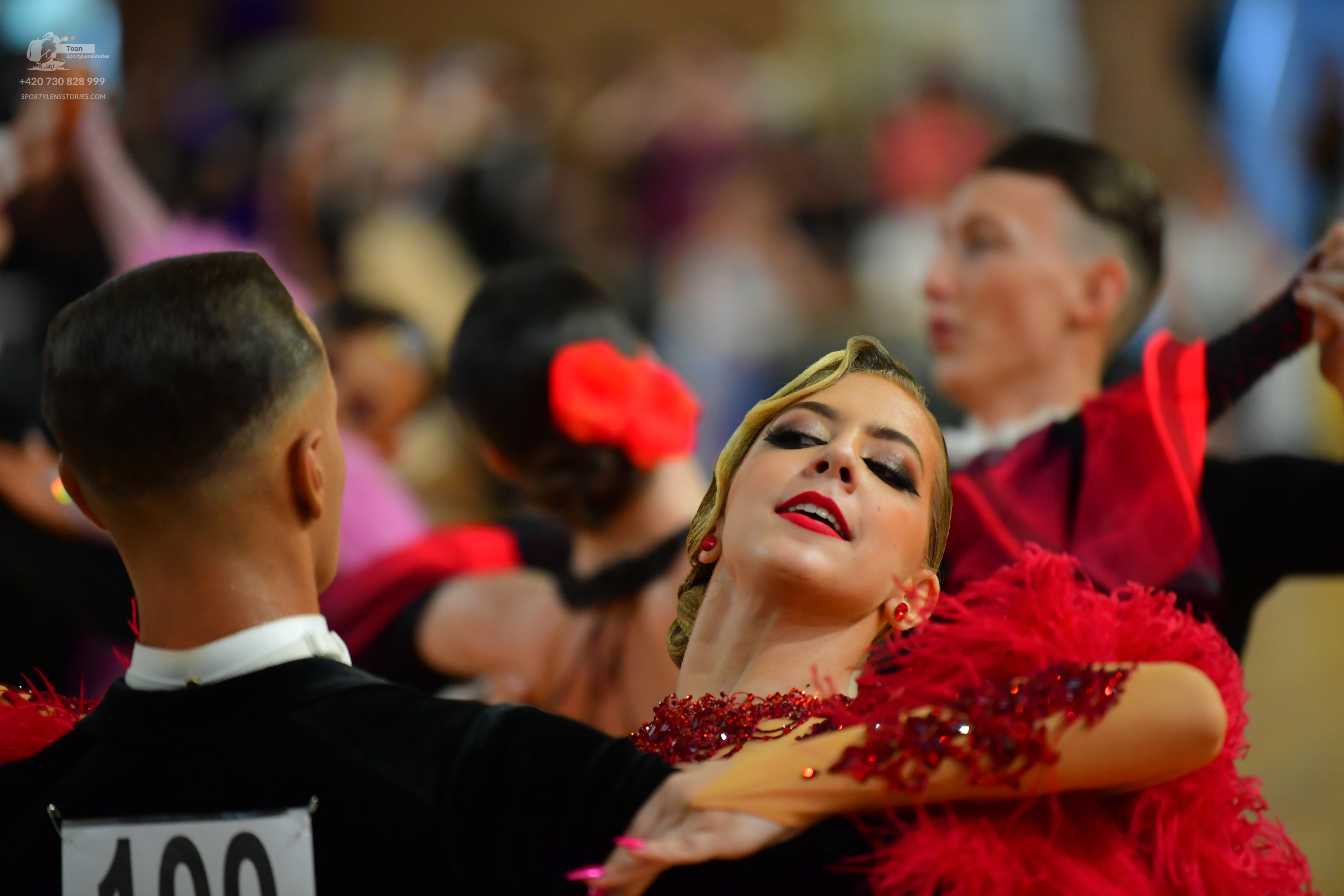 Dancesport competitor: ** Black suit with a sequin lapel
*   **Fabric:** Likely satin or a similar smoo