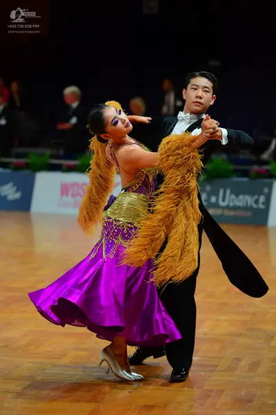 Dancesport competitor: Male dancer: black tailcoat, white shirt, and white bowtie