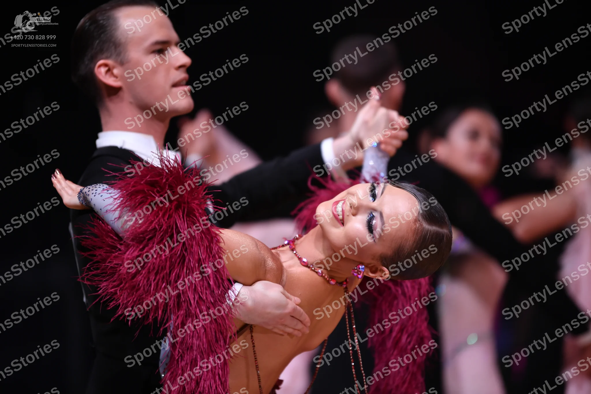 Dancesport competitor: Male dancer: black suit with a white shirt
