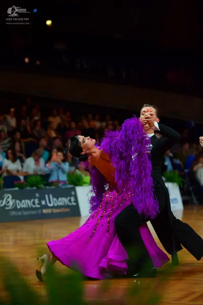 Dancesport competitor: Male dancer: black suit