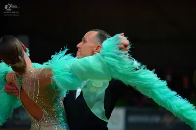 Dancesport competitor: Male dancer: black suit with a white shirt and black bowtie