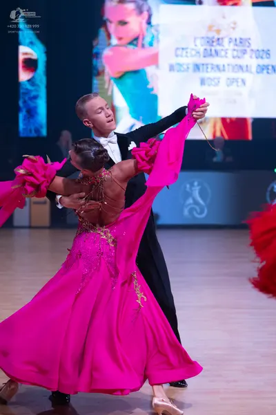 Dancesport competitor: Male dancer: black suit with a white shirt and white bowtie