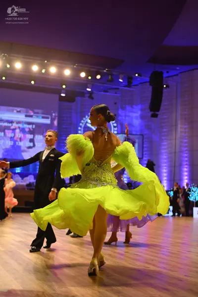 Dancesport competitor: Male dancer: black formal suit with a white shirt and black bow tie