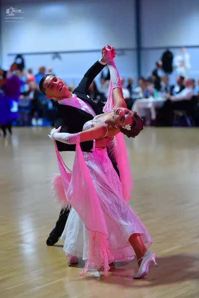 Dancesport competitor: Male dancer: black ballroom suit with white shirt