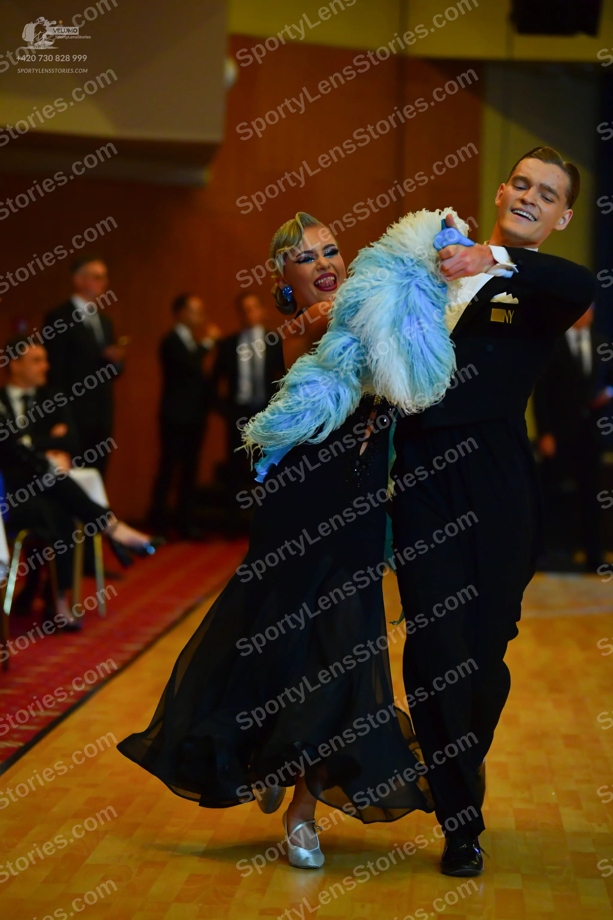 Dancesport competitor: Male dancer: black suit with black trousers and black dance shoes