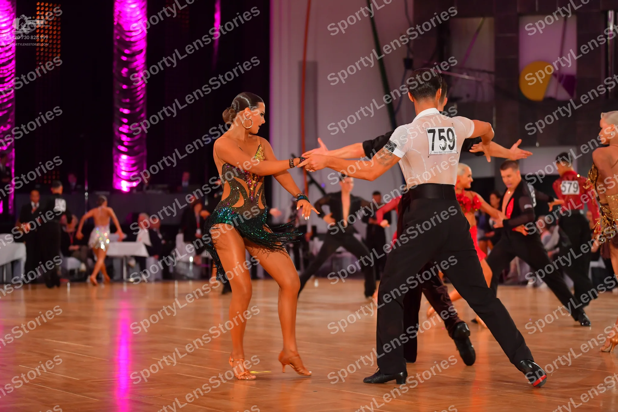 Dancesport competitor #759, #579: Male dancer 759: white short-sleeved shirt and black trousers