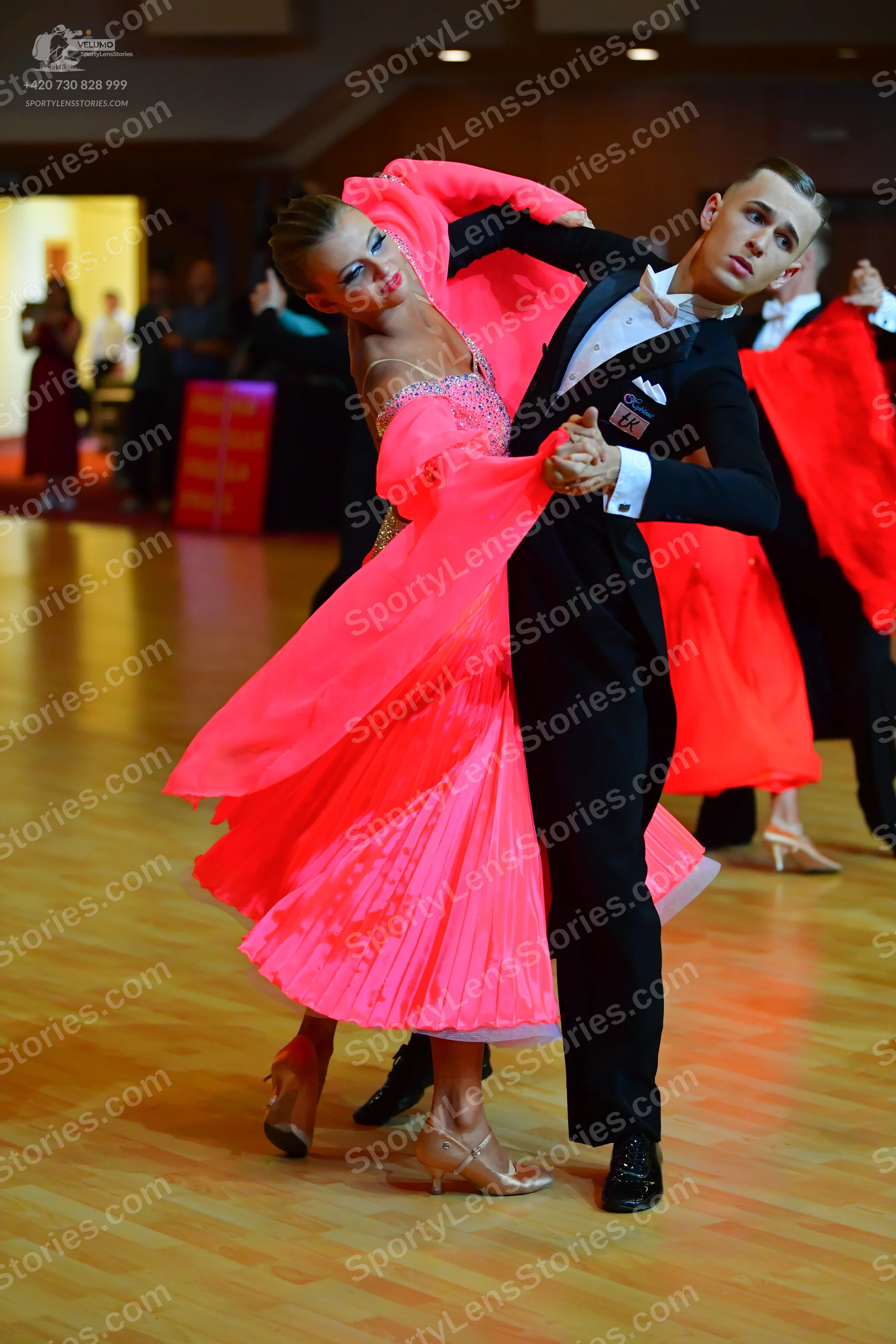 Dancesport competitor: Male dancer: black suit with a white shirt