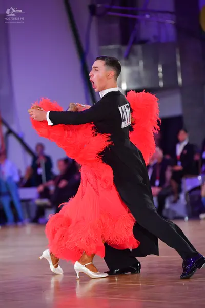 Dancesport competitor #417: Male dancer: black long-sleeved dance shirt with a white collar