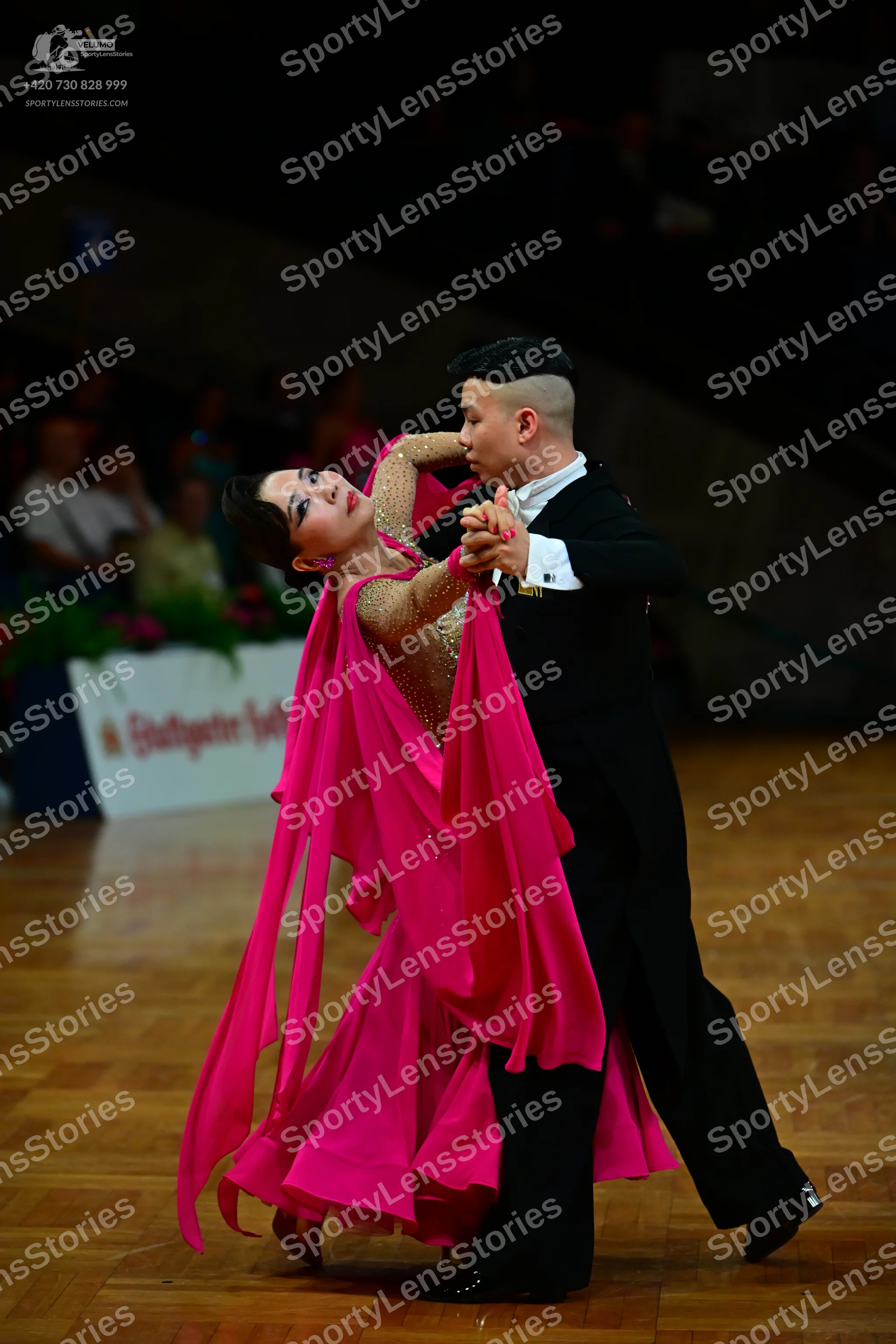 Dancesport competitor: Male dancer: black suit with a white shirt and black trousers