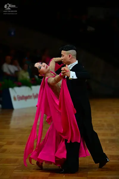 Dancesport competitor: Male dancer: black suit with a white shirt and black trousers