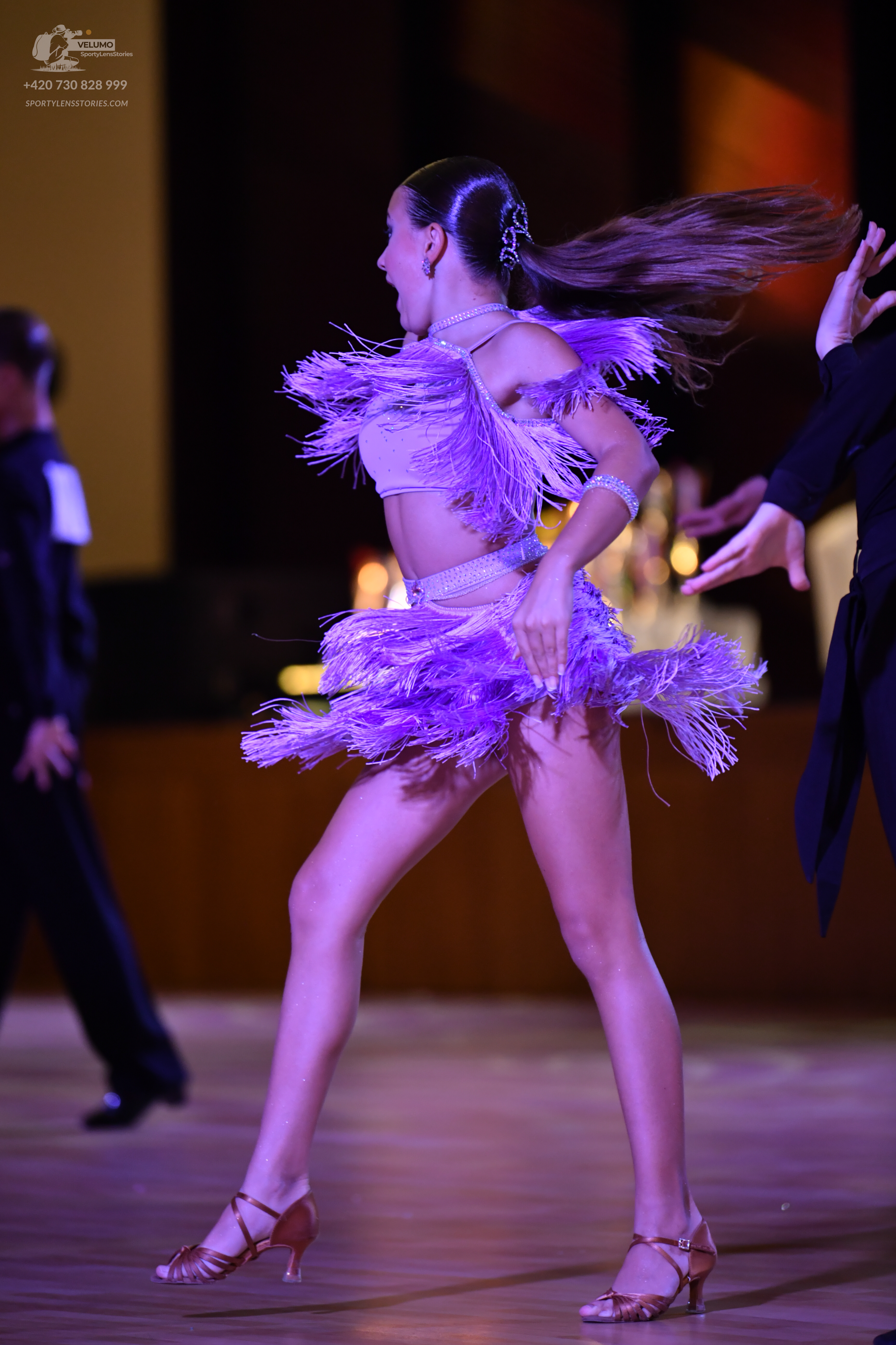Dancesport competitor: **

*   **Male 1:** Black suit with a sequin lapel