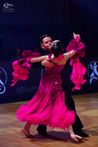 Dancesport competitor: Male dancer: black suit
