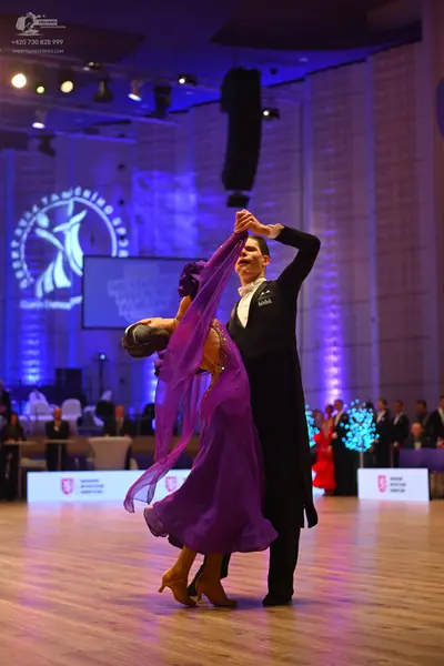 Dancesport competitor: Male dancer: black tailcoat with a white shirt and white bow tie