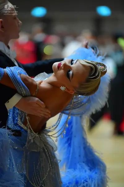 Dancesport competitor: Male dancer: black suit with a white shirt
