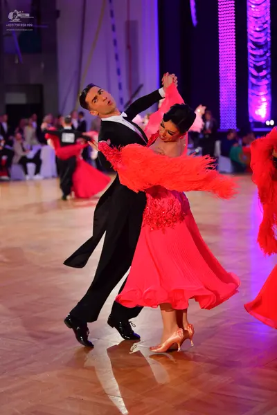 Dancesport competitor #73: Male dancer: black ballroom suit with a white shirt and black trousers