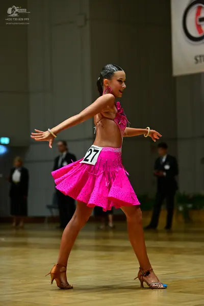 Dancesport competitor #27: Female dancer: pink latin dress with sequins and a short skirt
