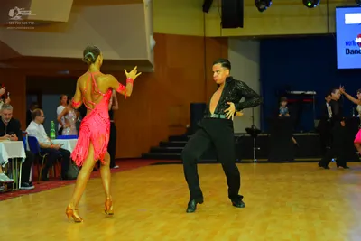 Dancesport competitor: Male dancer: black long-sleeved shirt with texture and black trousers