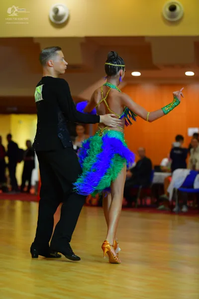 Dancesport competitor: Male dancer: black long-sleeved shirt and black trousers