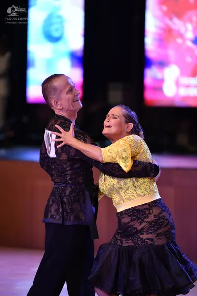 Dancesport competitor: ** Black tail suit