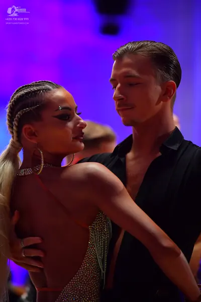 Dancesport competitor: Male dancer: black long-sleeved shirt