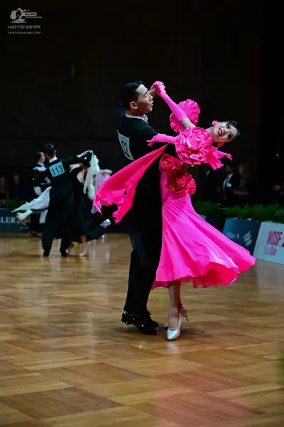 Dancesport competitor #62, #113: Male dancer (foreground): black dance suit