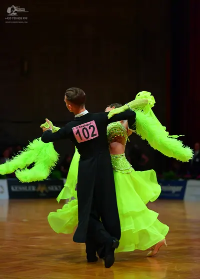 Dancesport competitor: Male dancer: black long-sleeved dance shirt and black trousers