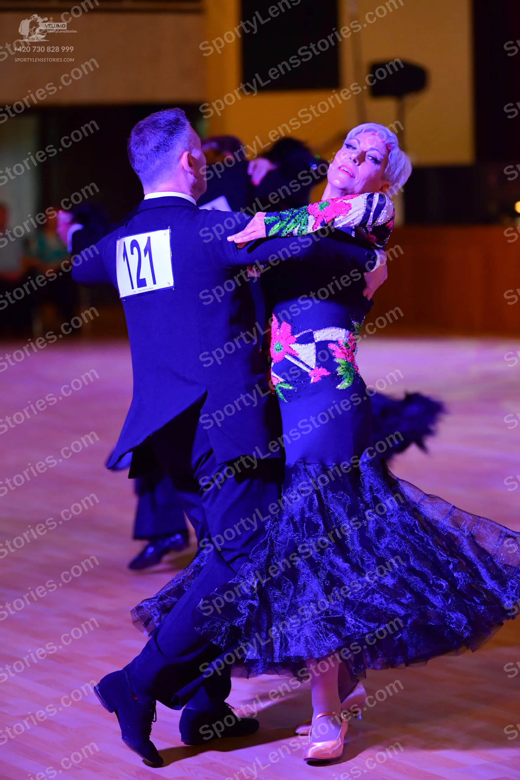Dancesport competitor: ** Black tailsuit with sequin lapels